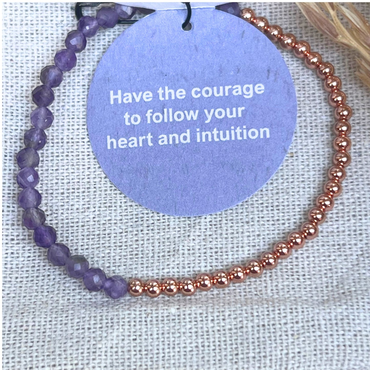 bracelet copper with faceted beads, tag on a grey nature background
