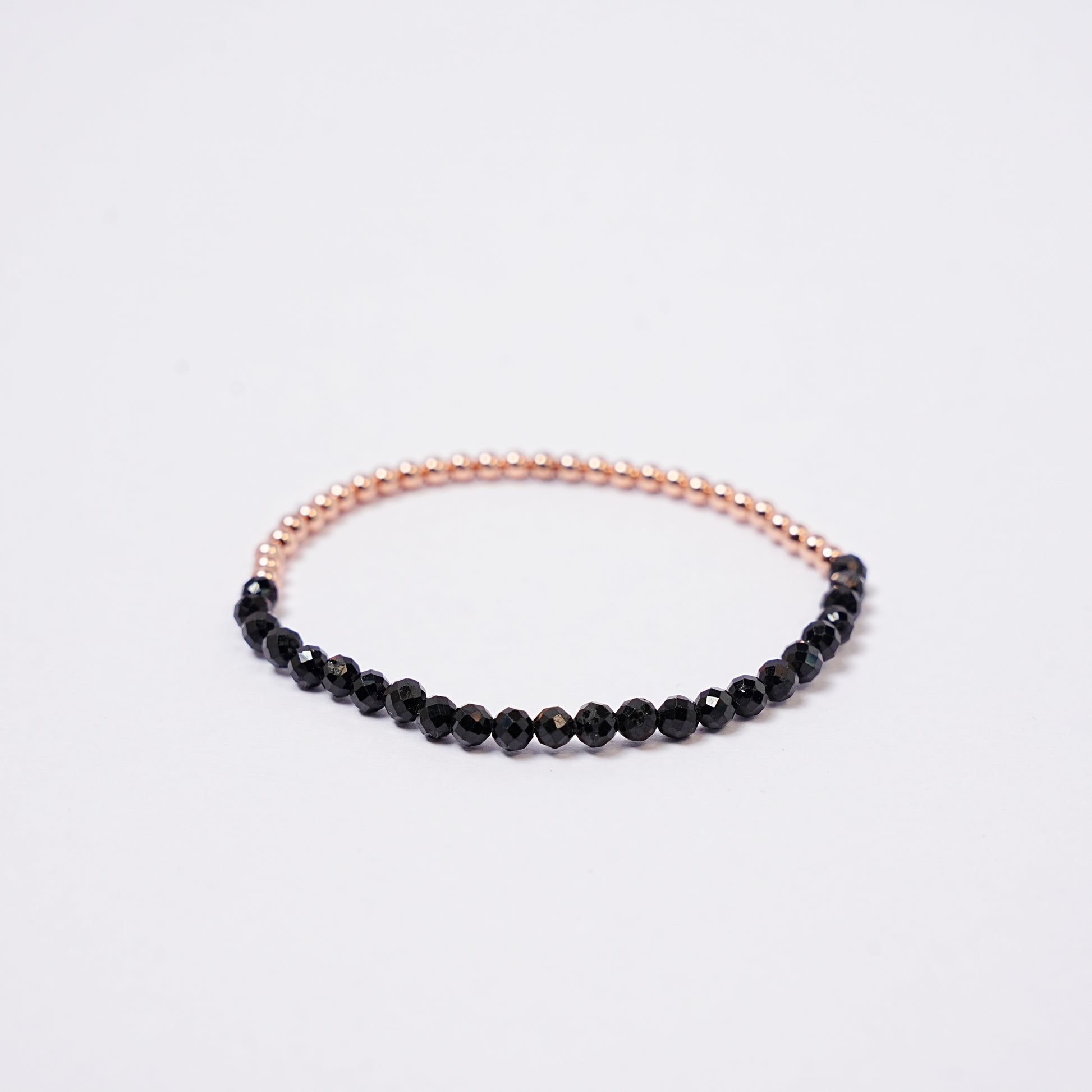 Black tourmaline bracelet with 3mm copper on a white background