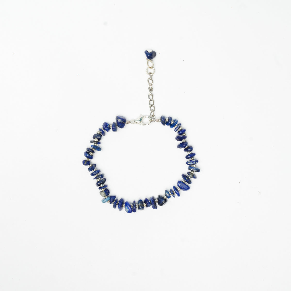 Bracelet with blue chips, white seed bead and silver chain on a white background