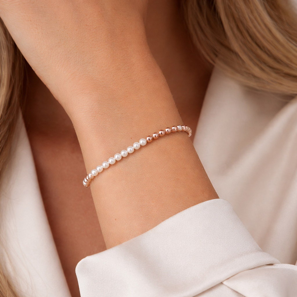 Pearl facted beaded bracelet on a wrist with a natural background