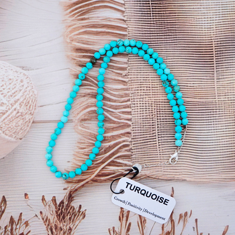 Turquoise and silver necklace with tag