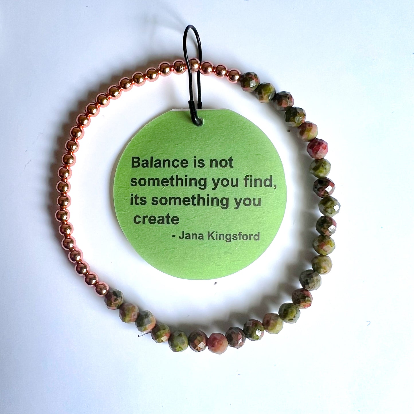 bracelet copper with faceted beads, tag on a white background