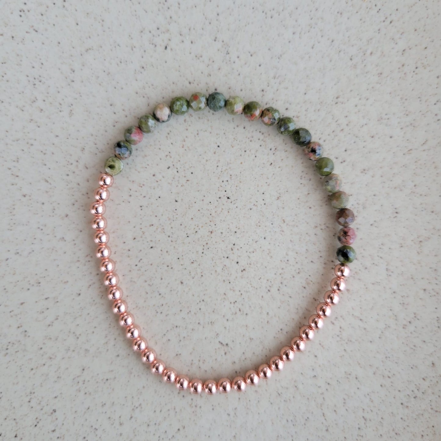 forest green bracelet with 3mm copper on a grey background