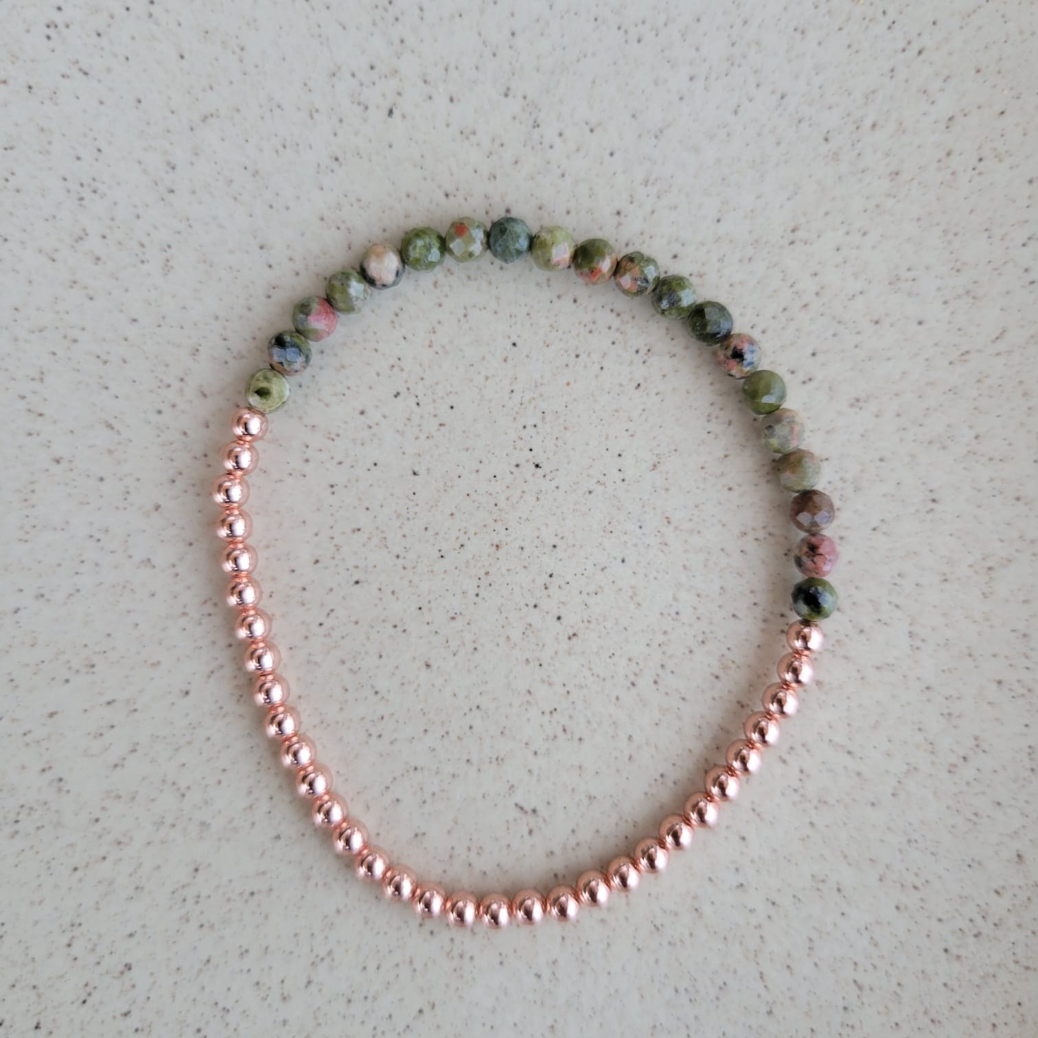 forest green bracelet with 3mm copper on a grey background