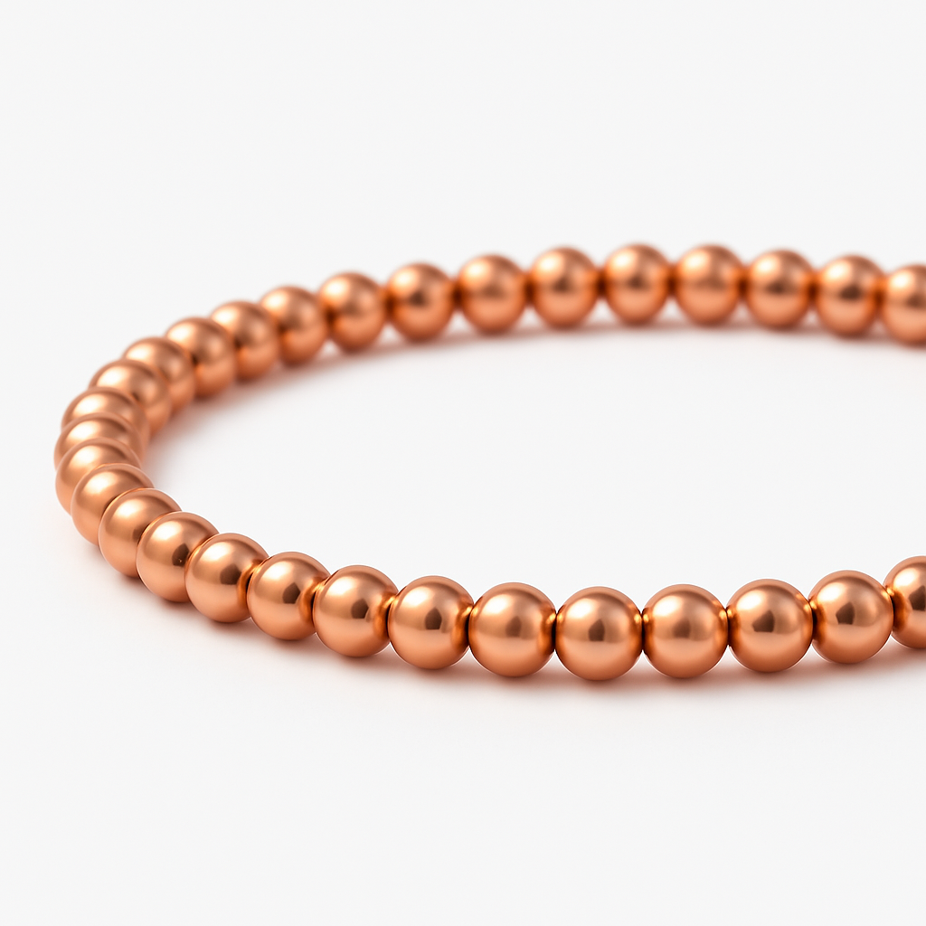 Uniformly sized, polished spherical metal beads strung onto a durable, flexible elastic stretch cord for an easy slip-on fit