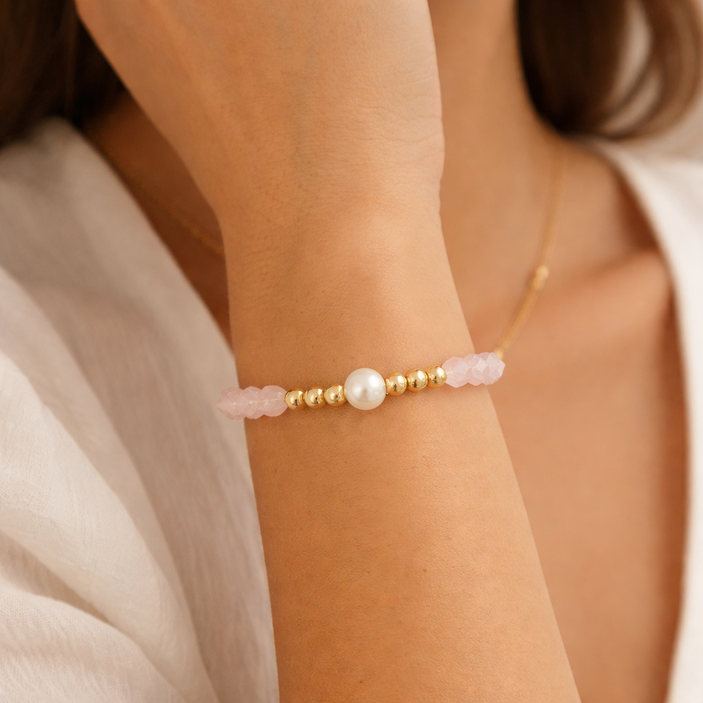 pink beaded bracelet on a wrist with a natural background  